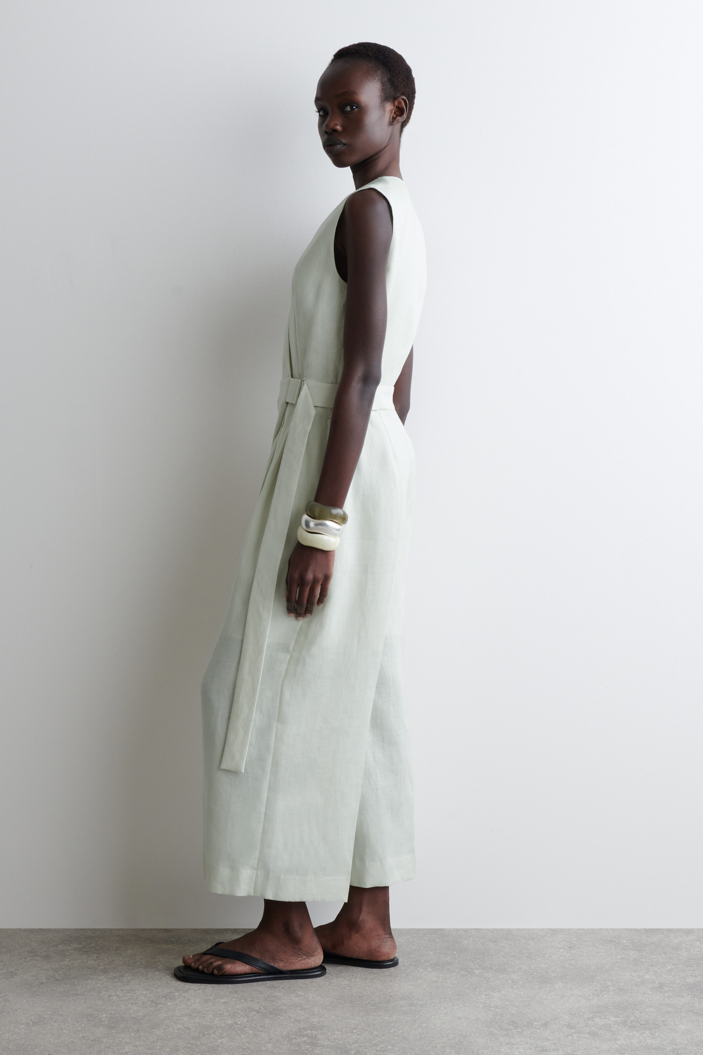 WRAP-FRONT LINEN JUMPSUIT - LIGHT GREEN | COS US