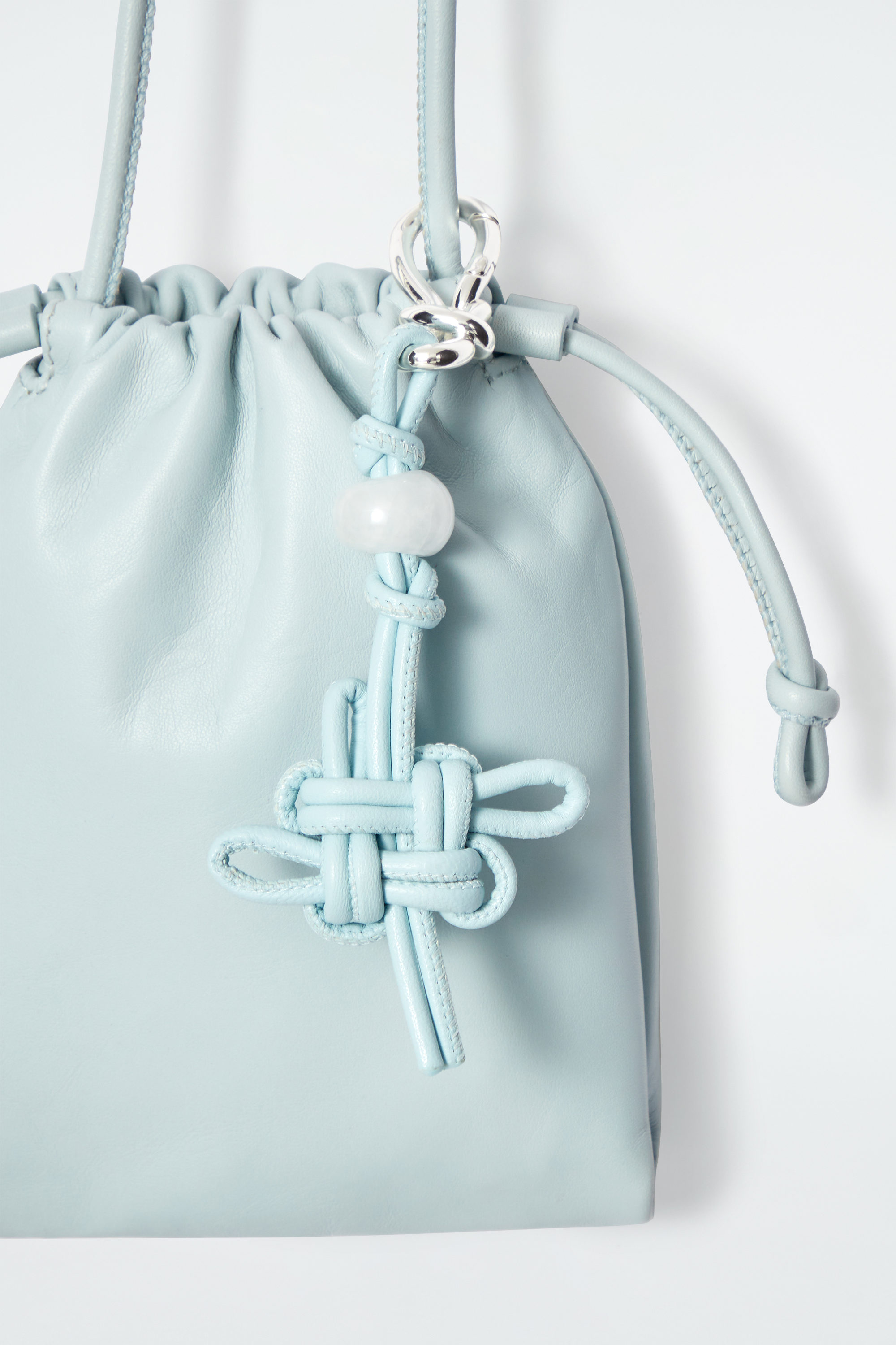 HARMONY KNOTTED BAG CHARM BLUE COS