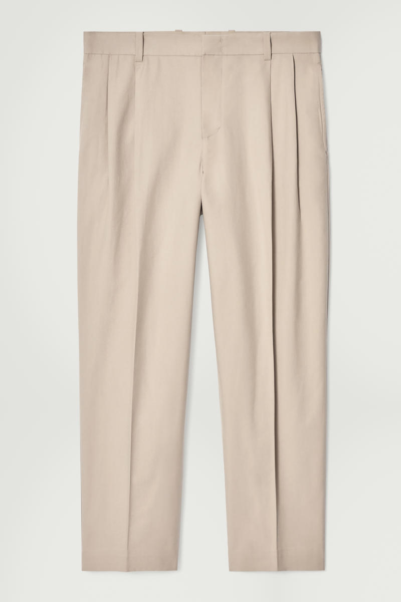 Relaxed Pleated Cotton Tapered Trousers in Beige