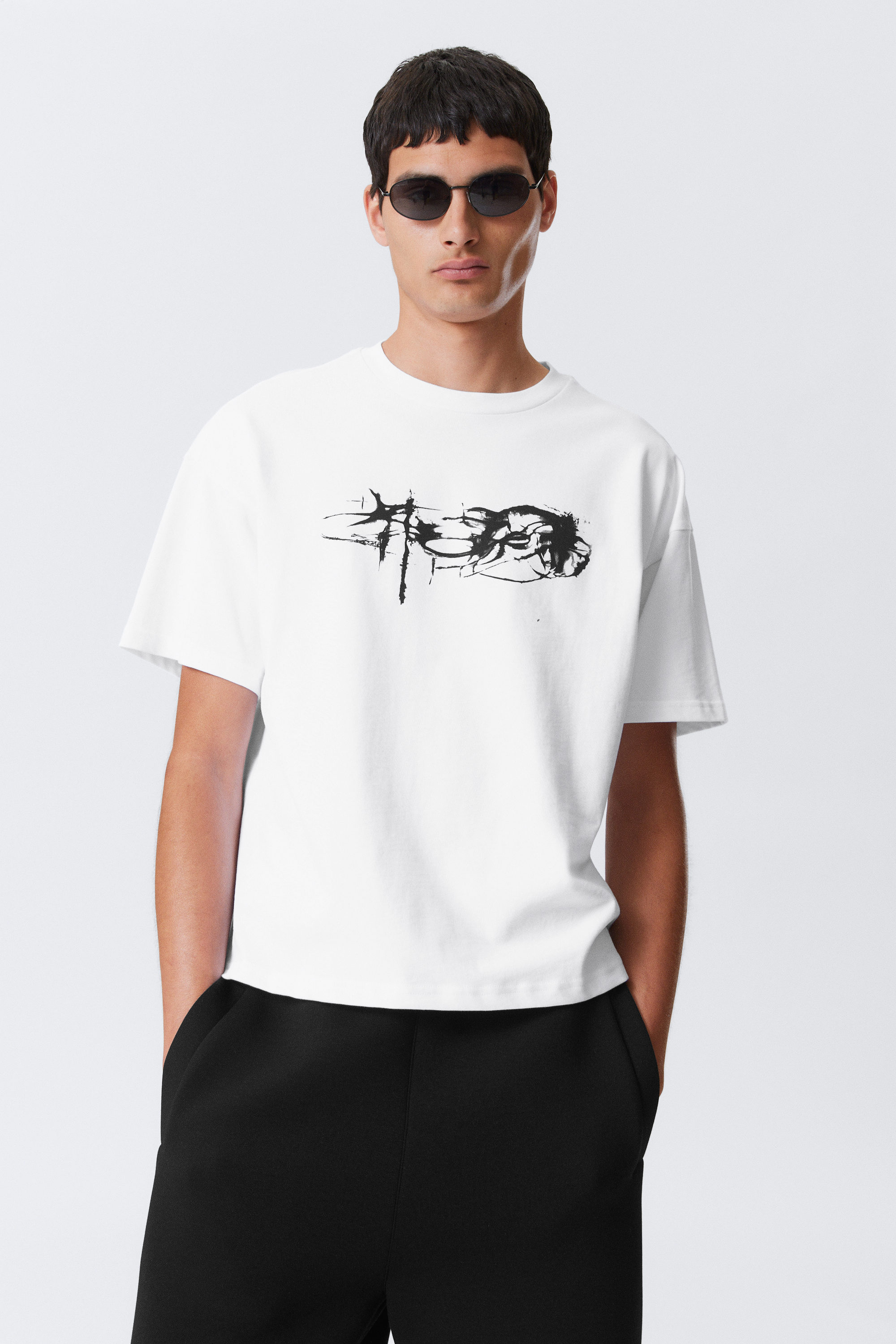 Bedrucktes kastiges T-Shirt