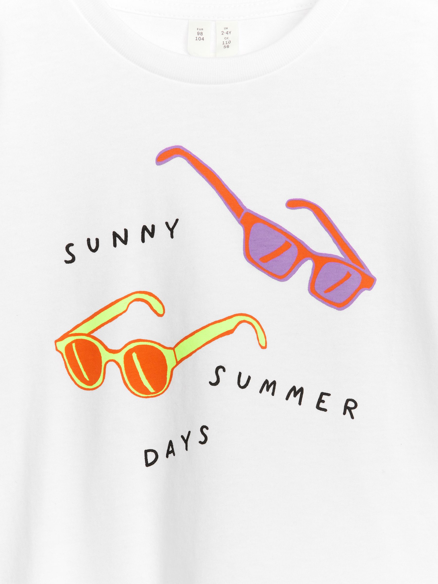 Camiseta de rayas - Blanco/estampado en color - Corte holgado - Children - StillMedia/DescriptiveDetail - 1